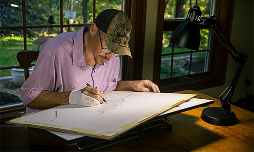 Joseph working in his traveling art studio